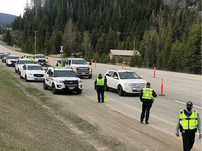 Handout photo of RCMP at the at the Travel Restriction Road Check on Highway 3 in the Manning Park area. B.C. RCMP announced today they will be establishing COVID-19 Travel Restriction Road Checks at select locations starting this Thursday, May 6, as part of the provincial ban on non-essential travel.