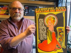 Rob Frith holds A 1967 Bob Masse psychedelic poster for the Grateful Dead gig at Dante's Inferno, at Neptoon Records on Main Street.