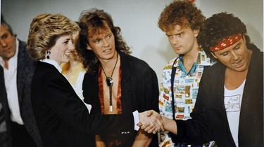 Princess Diana meets with member of the Vancouver rock band Loverboy backstage at the Expo Theatre in Vancouver during the Royal Tour of May 1986.
