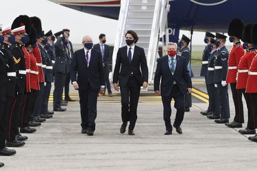 Canadian Prime Minister Justin Trudeau, (C), arrives ahead of the G7 meeting at Cornwall airport on June 10, 2021 in Newquay, England.