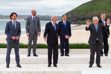 (L-R) Canadian Prime Minister Justin Trudeau, President of the European Council Charles Michel, US President Joe Biden, Japanese Prime Minister Yoshihide Suga, British Prime Minister Boris Johnson and Italian Prime Minister Mario Draghi pose for the Leaders official welcome and family photo during the G7 Summit In Carbis Bay, on June 11,