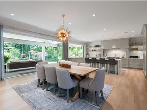 This North Vancouver home was designed for entertaining — eclipse doors open to an expansive covered patio complete with heaters and a built-in barbecue.