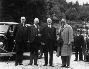 Former Canadian Prime Minister RB Bennett, WH Evans, Peter Barnhart and Vancouver Mayor Gerry McGeer at the arrival of the reenactment of the first train on July 3, 1936. Evans was the engineer for the first train to arrive in Port Moody on July 3, 1886, Barnhart was the conductor.  Vancouver Archives AM177-F01-: CVA 612-066