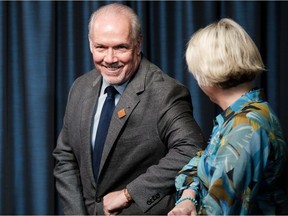 Premier John Horgan and Dr. Bonnie Henry.