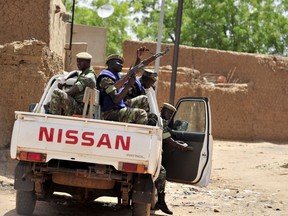 File photo: Burkinabe soldiers patrol in a pick-up car in Gorom-Gorom, northern Burkina Faso in 2012