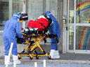 Ambulance attendants transport a resident from a seniors' long-term care home, amid the outbreak of COVID-19 in Laval, Quebec, April 16, 2020. Quebec 