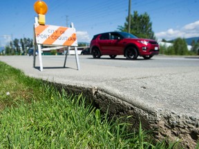 A heat-buckled sidewalk on Kingsway Avenue in Port Coquitlam, BC Saturday, July 3, 2021. Record high temperatures have blanketed much of Western Canada for the past week.