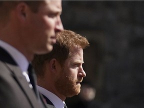Britain's Prince William, Duke of Cambridge, Peter Phillips and Britain's Prince Harry, Duke of Sussex walk during the funeral procession of Britain's Prince Philip, Duke of Edinburgh to St George's Chapel in Windsor Castle in Windsor, west of London, on April 17, 2021.