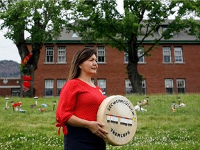 Tk'emlups te Secwepemc boss Rosanne Casimir takes a break while speaking to reporters outside the former Kamloops Indian Residential School in Kamloops on Friday June 4, 2021.