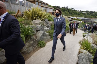 Canada's Prime Minister Justin Trudeau walks through the resort during the G7 summit in Carbis Bay in Carbis Bay, on June 11, 2021.