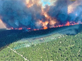 Smoke and flames are seen during the Sparks Lake wildfire.