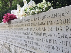 Fresh flowers on the Air India memorial wall at Stanley Park.