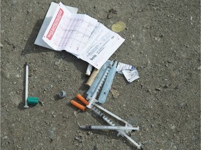 Needles are seen on the ground in Oppenheimer park in Vancouver's downtown eastside on March 17, 2020.