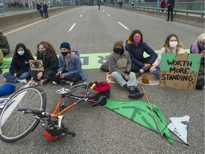 Several hundred protesters, hosted by the group Extinction Rebellion, blocked traffic and shut down the Cambie Street bridge in the name of climate change Saturday afternoon Saturday, March 27, 2021.