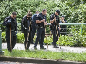 Vancouver police search an area Saturday morning June 5, 2021 for evidence related to a late Friday night shooting on E. Kent Avenue in Vancouver. One person was shot and killed.