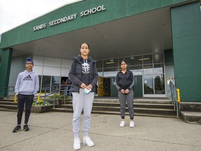 From left: Parveer Gill, Parneet Gill and Sumreet Bains are among the Sands Secondary students in Delta organizing an electronic waste drop-off.