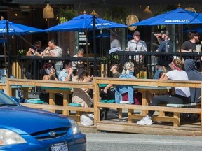 Outdoor patios like this one outside Havana on Commercial Drive could become permanent summer fixtures in Vancouver.