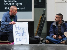 Anti-logging climate activists and members of Extinction Rebellion, Brent Eichler (left)  and Zain Haq are staging a hunger strike until they get an urgent meeting with Premier John Horgan, Forests Minister Katrine Conroy and federal Minister for Environment and Climate Change Jonathan Wilkinson, in Vancouver, BC., on June 13, 2021.