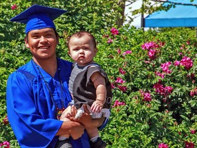 Keanu Johnson, shown with his 10-month-old son Skylar, will be graduating from Tsawalk Learning Centre on June 16. Now the Nanaimo centre is being closed on provincial orders and its programming is being taken over by the local school district.