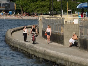 People enjoy the weather in Vancouver, BC, June 23, 2021.