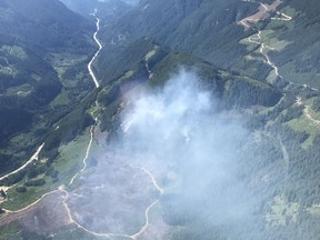 Smoke billows from the Eleven Mile Creek fire near Hope on June 24. That 50-hectare blaze is ‘being held,’ considered under control.