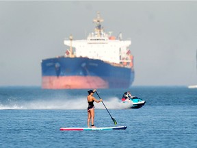 A paddleboarder in action at English Bay in Vancouver, BC., on June 27, 2021. A large group of paddleboarders were rescued on Labour Day after trying to cross English Bay.