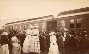 July 27, 1886. Arrival of Canadian Prime Minister Sir John A. Macdonald and his wife by CPR train at Port Moody.  Sir John A. MacDonald is No. 13 and Lady MacDonald is No. 14. Others identified are: 1. Mrs. Norman Fraser, 2. Mrs. John Fraser, 3. John Murray, 4. Miss Liah Scott, 5. EK Perry, 6. Miss Nellie Dockrill, 7. Mrs. EK Perry, 8 .Norman Fraser, 9. TJ Trapp, 10. Ham Lipsett, 11. ship's mate 