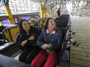Vancouver Sun columnist Shelley Fralic (right) prior to riding the Wooden Roller Coaster at Playland, for the first time in her life, with PNE media relations manager Laura Ballance Thursday, August 29, 2013.