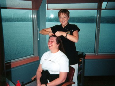 Shelley Fralic gets French braids from Jacqui Pascali on an Alaska cruise aboard the Infinity in 2001.