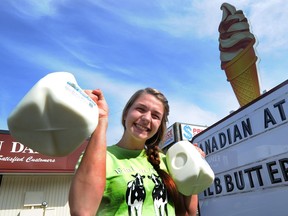 Edaleen Dairy in Washington state has noticed a reduction in sales since COVID-19-related border restrictions took effect. Edaleen employee Daley Duncan in a file photo from August 2012.