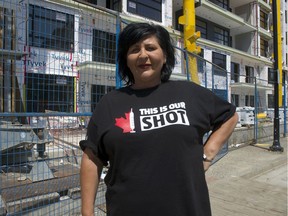 Langley City Mayor Val van den Broek stands by a residential building under construction in Langley. Van den Broek says she is thrilled at the transit funding announcement this week by Prime Minister Justin Trudeau and she expects it will lead to a building boom in her city.