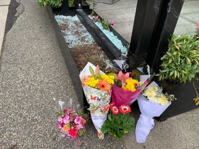 Flowers lay at a makeshift memorial on Hornby Street on Wednesday, July 7, 2021.