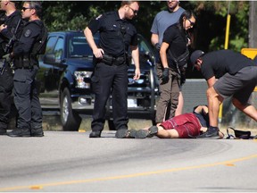 An unidentified man is detained in Kerrisdale neighbourhood on the early morning of July 10, 2021. Vancouver police were at the scene of a homicide at a home near South West Marine Drive and West 57th Avenue.