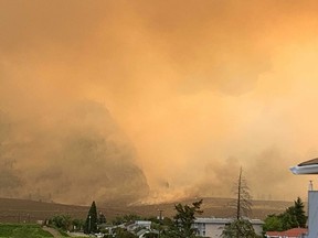 Scenes from Osoyoos. Smoke hangs thick in the air Tuesday from the nearby Nk’Mip Creek wildfire.