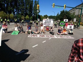 A group of climate activists blocked an intersection south of the Burrard Bridge on Saturday.