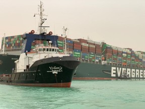 The Taiwan-owned MV Ever Given (Evergreen) ran aground in the Suez Canal after a gust of wind blew it off course
