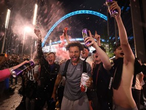 England fans gather during the Euro 2020 finals outside Wembley Stadium in London, July 11, 2021.