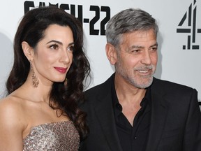 Amal Clooney and George Clooney attend the "Catch 22" U.K. premiere on May 15, 2019 in London.
