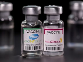 Vials with Pfizer-BioNTech and AstraZeneca coronavirus disease (COVID-19) vaccine labels are seen in this illustration picture taken March 19, 2021.