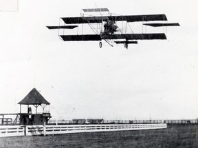 An early flight of a Curtiss biplane at Minoru race track, Lulu Island, Richmond.