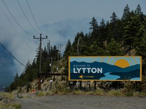The sign for the town of Lytton, where a wildfire raged through and forced residents to evacuate, is seen in Lytton on July 1, 2021.