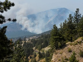 A wildfire burns outside of the town of Lytton, where a wildfire raged through and forced everyone to evacuate on July 1, 2021.