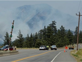 A police blockade outside of the town of Lytton, where a wildfire raged through and forced residents to evacuate, in Lytton, British Columbia, Canada July 1, 2021.