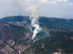 Smoke rises outside of Lytton, where a wildfire destroyed the town on June 30, as seen in this aerial photograph taken  July 6, 2021.