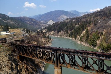 The charred remnants of the rail bridge, destroyed by a wildfire on June 30, is seen during a media tour by authorities in Lytton, British Columbia, Canada July 9, 2021.  REUTERS/Jennifer Gauthier