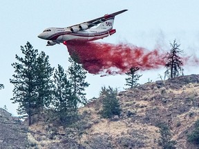 A Conair airtanker drops fire retardant on part of the Nk'Mip Creek wildfire near Osoyoos.