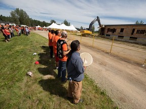 This past week the Lower Post residential school building, a source of trauma and painful memories, was demolished and the grounds blessed in ceremony to prepare for a new multi-purpose cultural centre — a space for self-government meetings, for social and cultural gatherings. Photo by Justin Kennedy