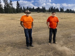 Greg Crookes (right), natural resource manager for the High Bar First Nation, with High Bar First Nation Chief Roy Fletcher on bone-dry grass at Clinton.