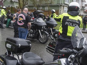 Vancouver police watch as about 100 Hells Angels members and affiliated clubs rally for their annual Screwy Ride in 2019. Expect a return to scenes like this now that COVID-19 is waning. The annual event is a memorial ride for slain HA member Dave 'Screwy' Swartz.