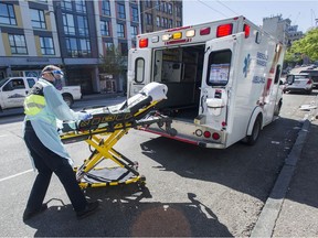Paramedics respond to an emergency medical call in the 100-block E. Hastings Street in Vancouver.